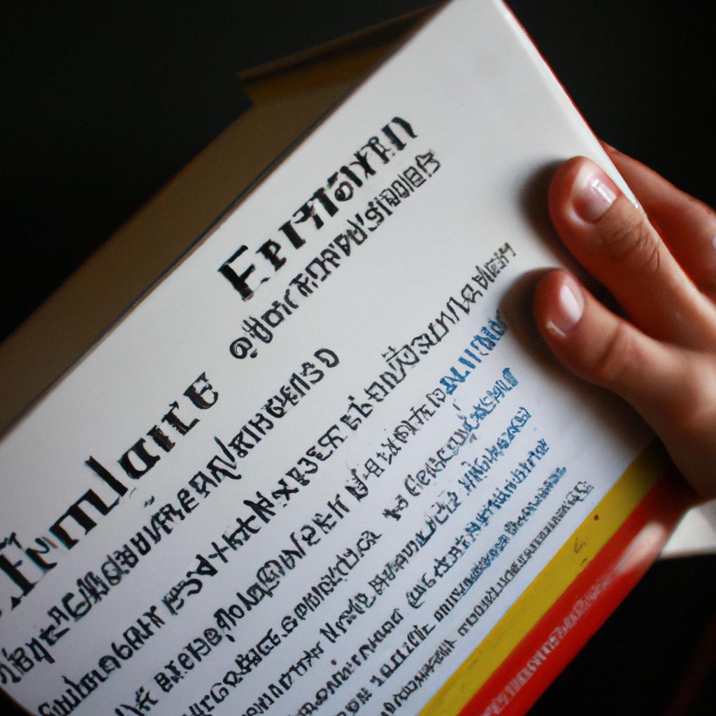 Person holding French reference dictionary