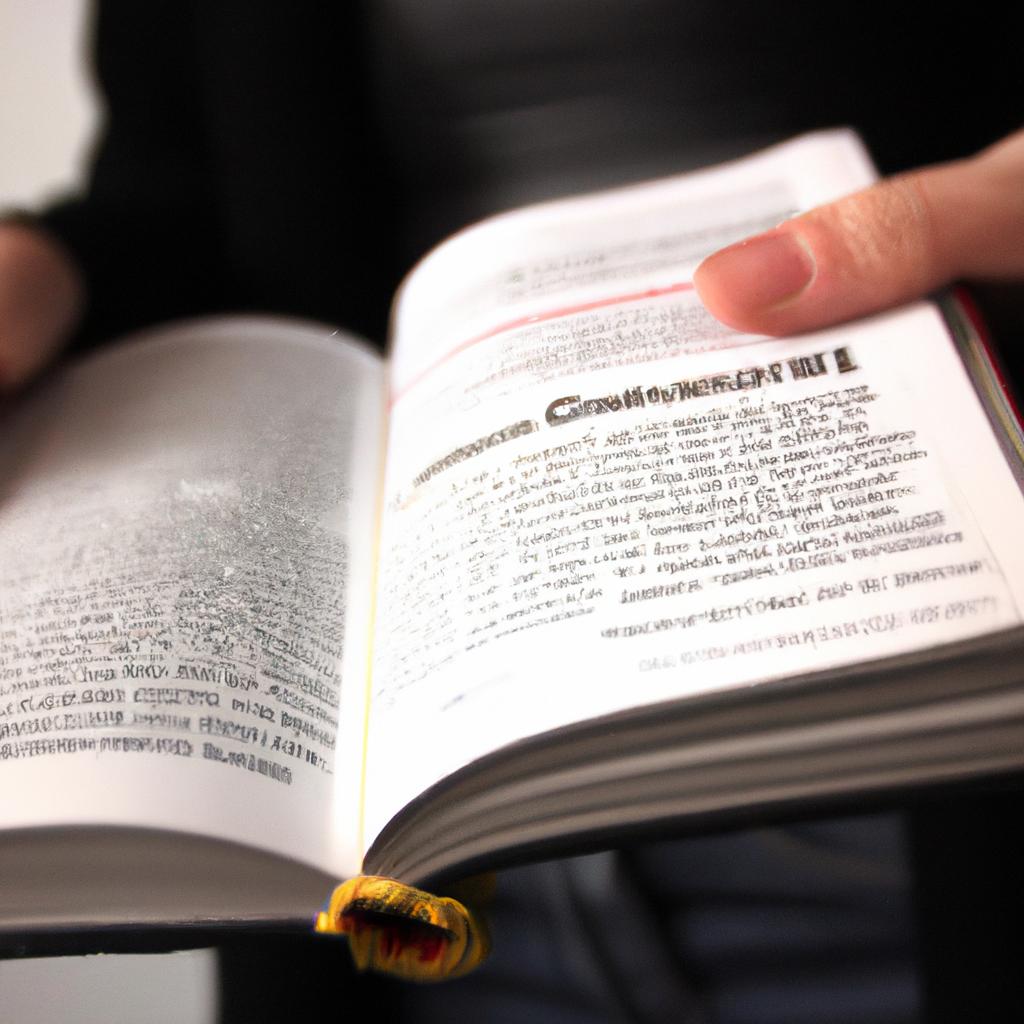 Person holding German dictionary, explaining