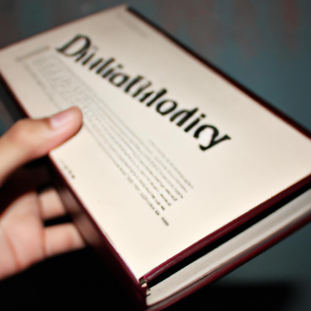 Person holding a dictionary book
