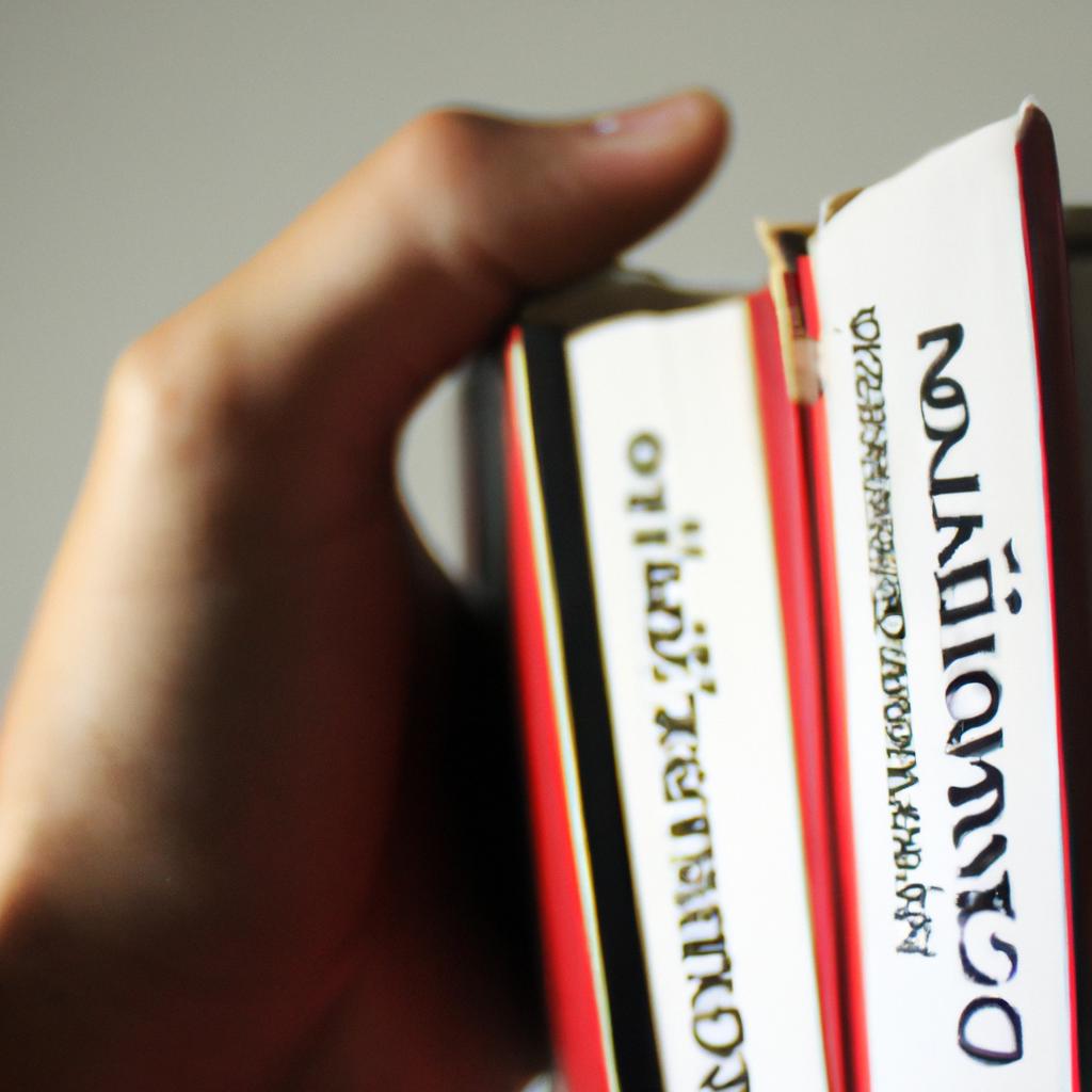 Person holding Spanish reference dictionaries